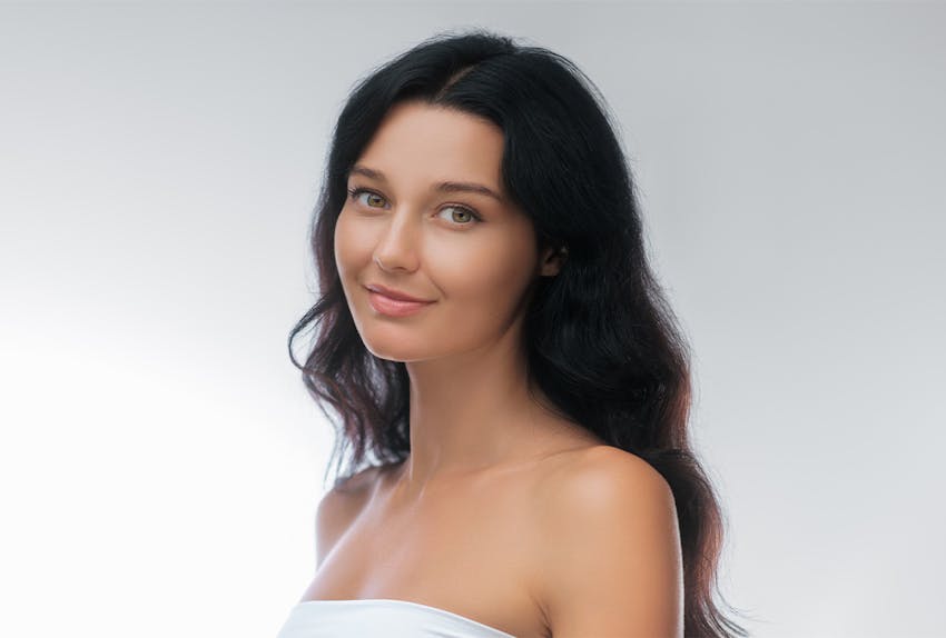 woman smirking into camera