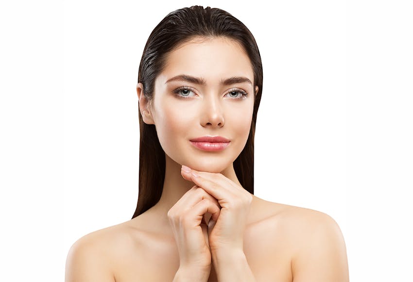 women with hands on chin