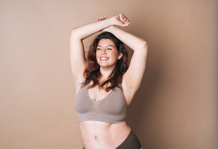 women with both hands above her head