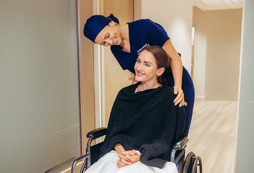 Woman and nurse smiling