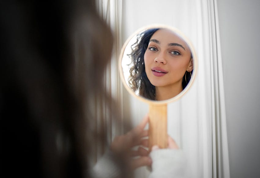 women looking in mirror