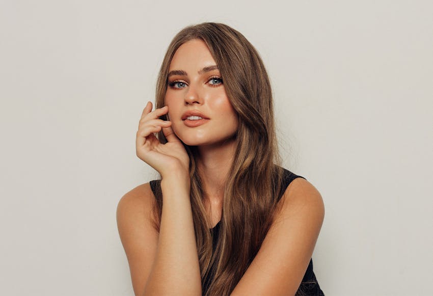 woman with hand in hair
