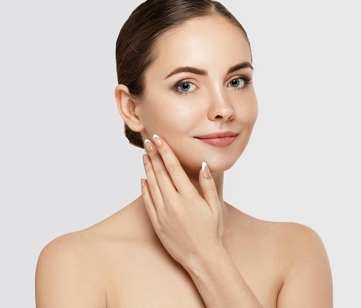 woman touching cheek