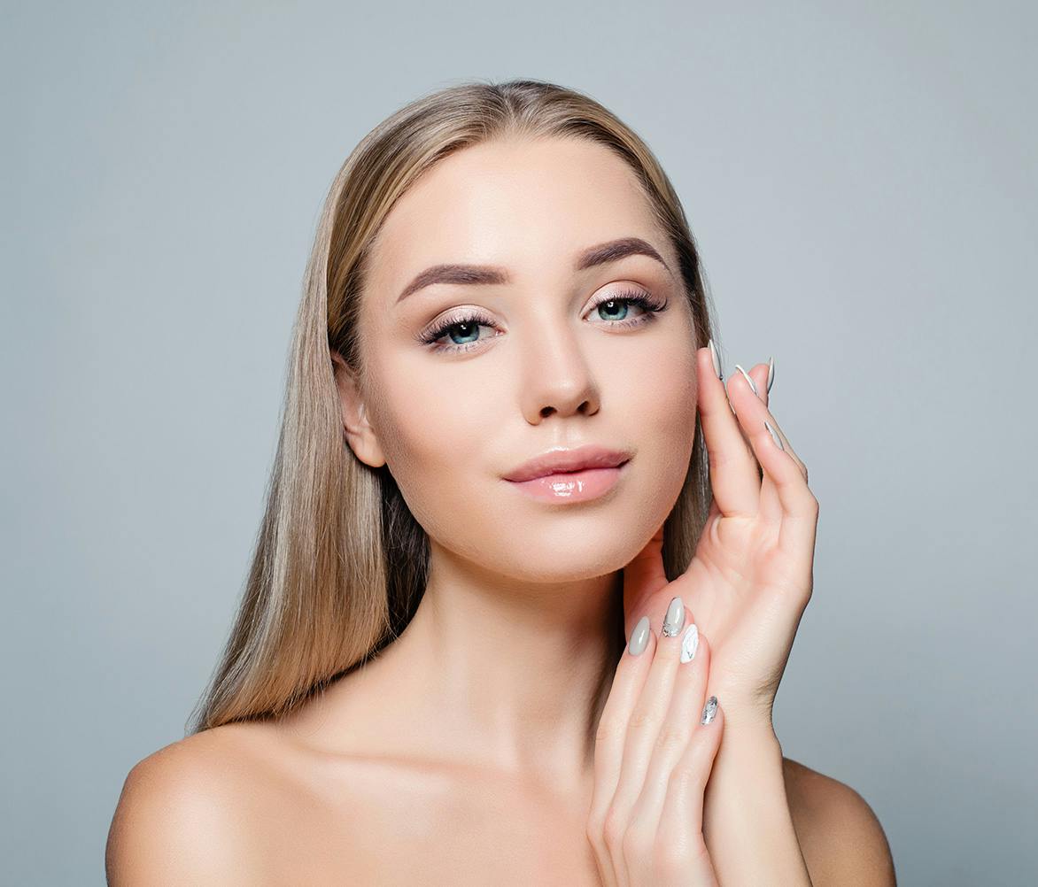 women touching her face