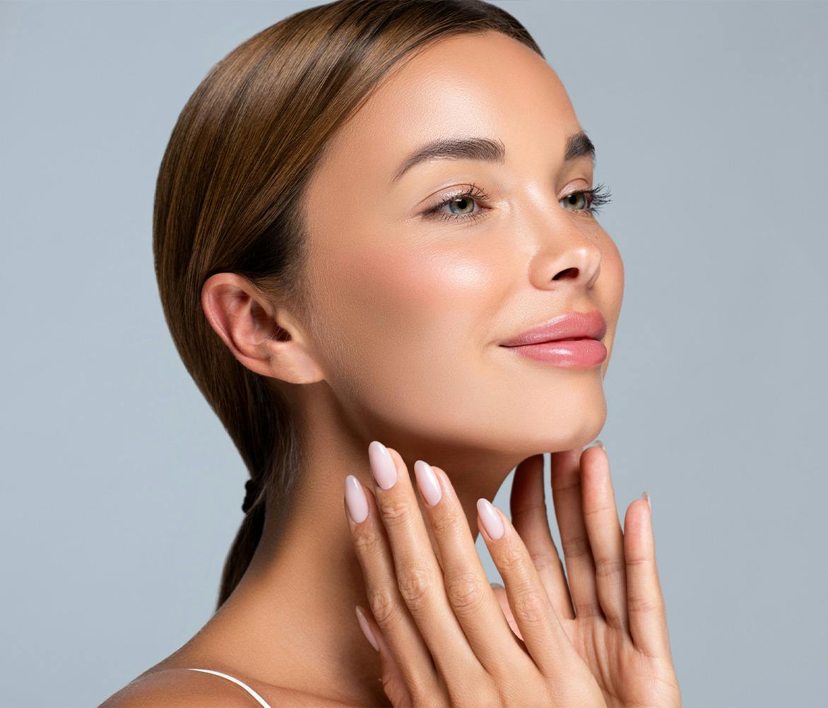 woman with hands on neck