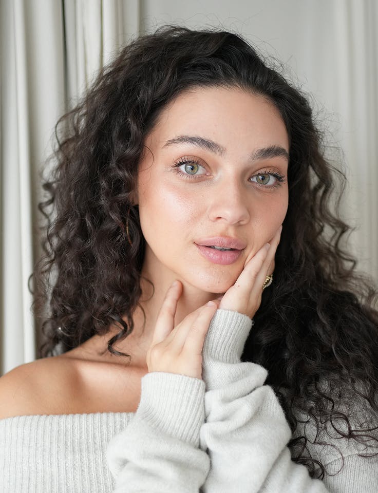 women hands on cheek