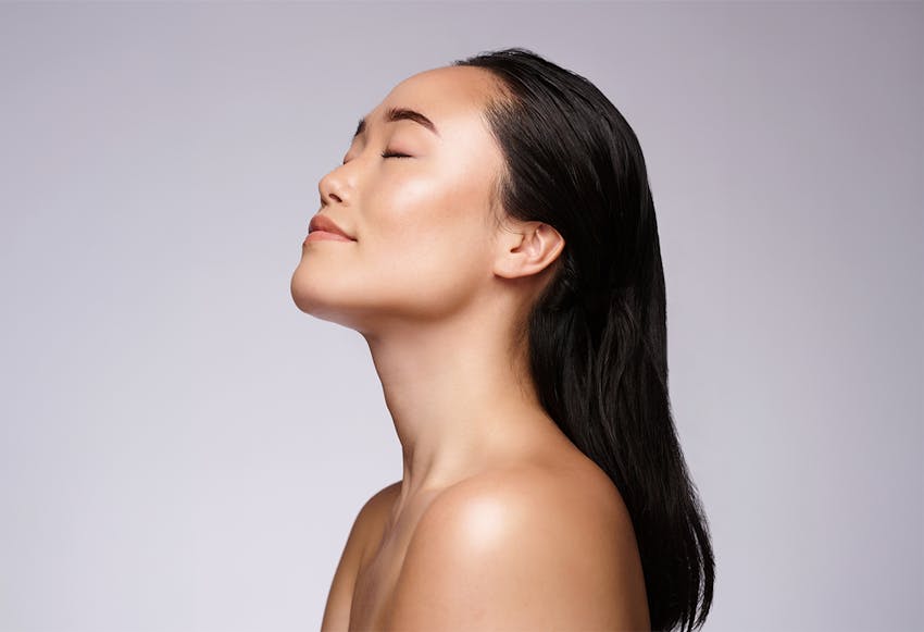 woman looking to the side with arms crossed