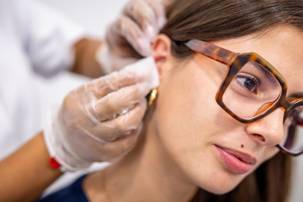 woman getting her ear cleaned
