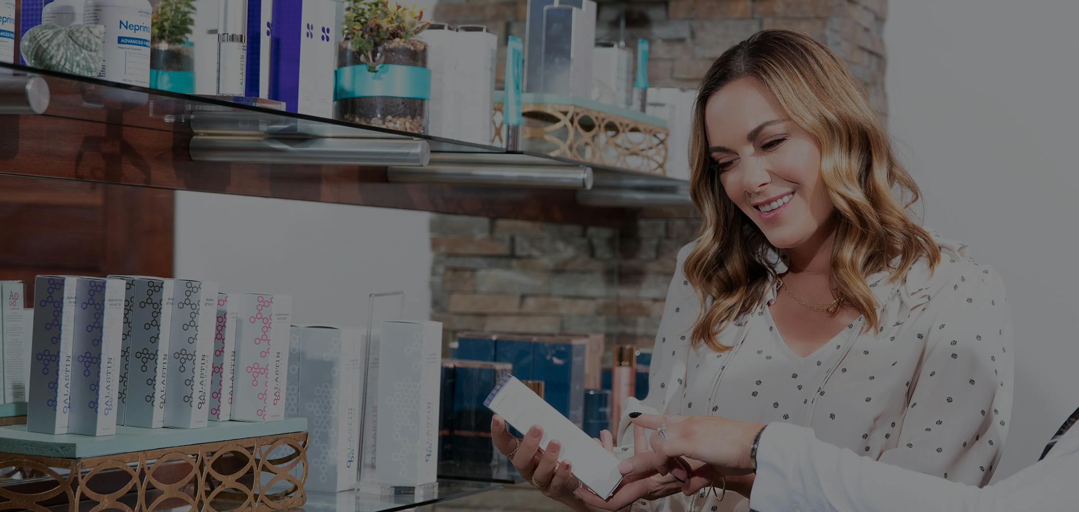 Woman looking at ingredients in skincare product