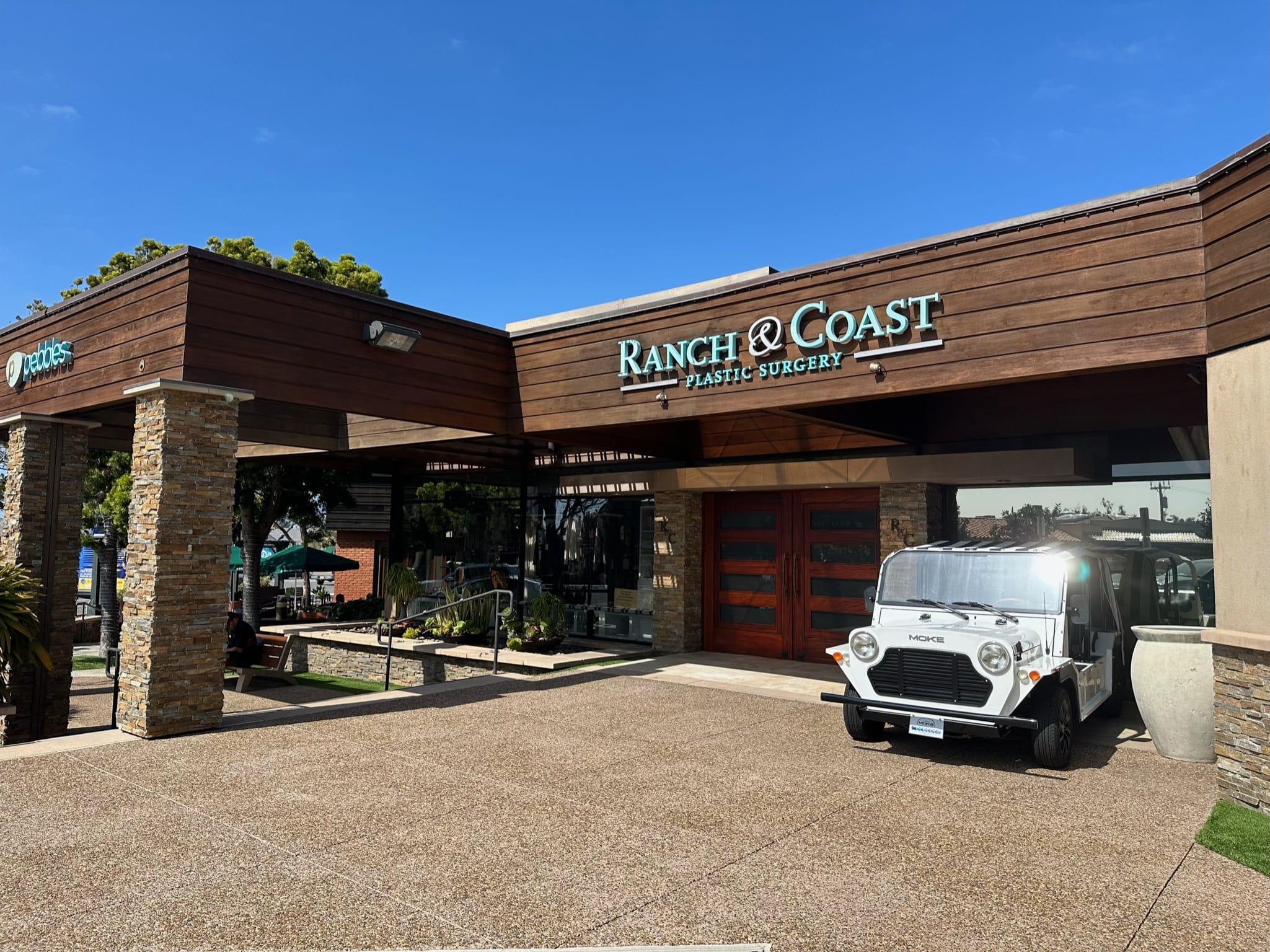 View of Ranch & Coast Plastic Surgery and nearby storefronts