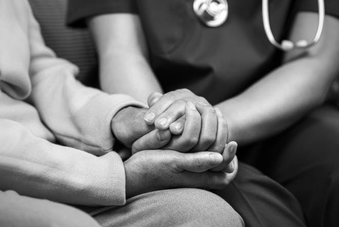 doctor holding someones hand