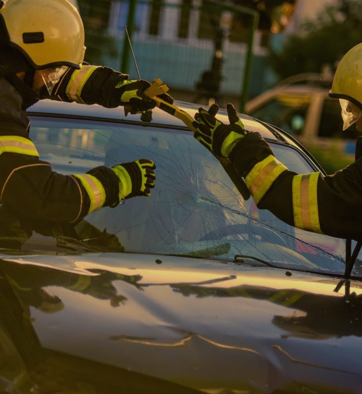 workers helping after a car accident