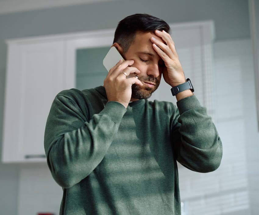 man on the phone looking upset