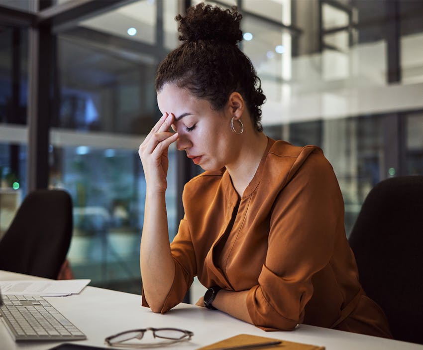 woman leaning her head on her hand
