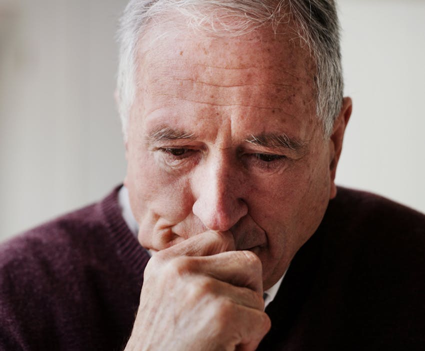 man holding his chin