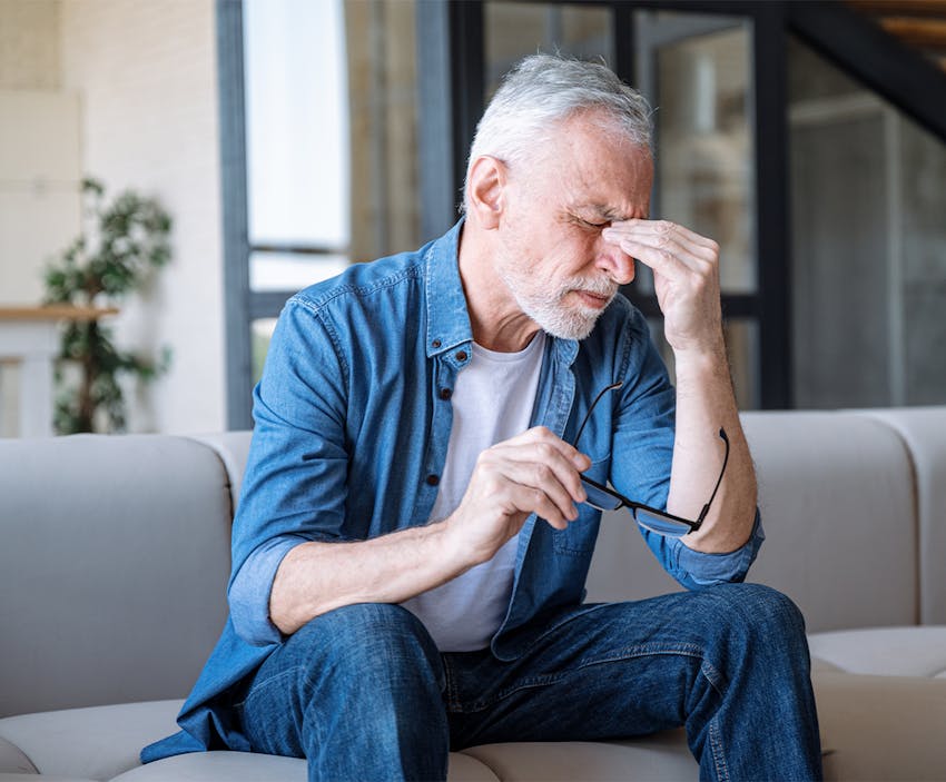 Man holding his head in pain