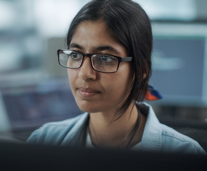 woman looking at a computer
