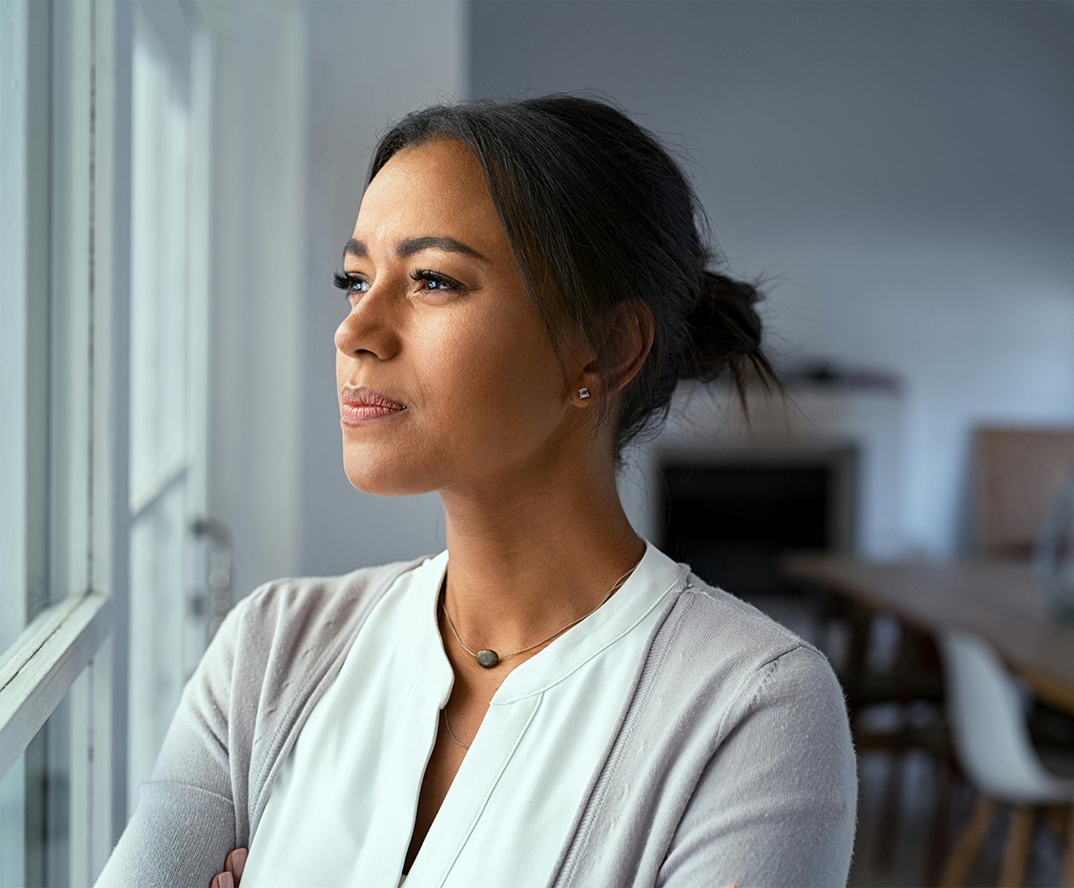 woman looking out a window