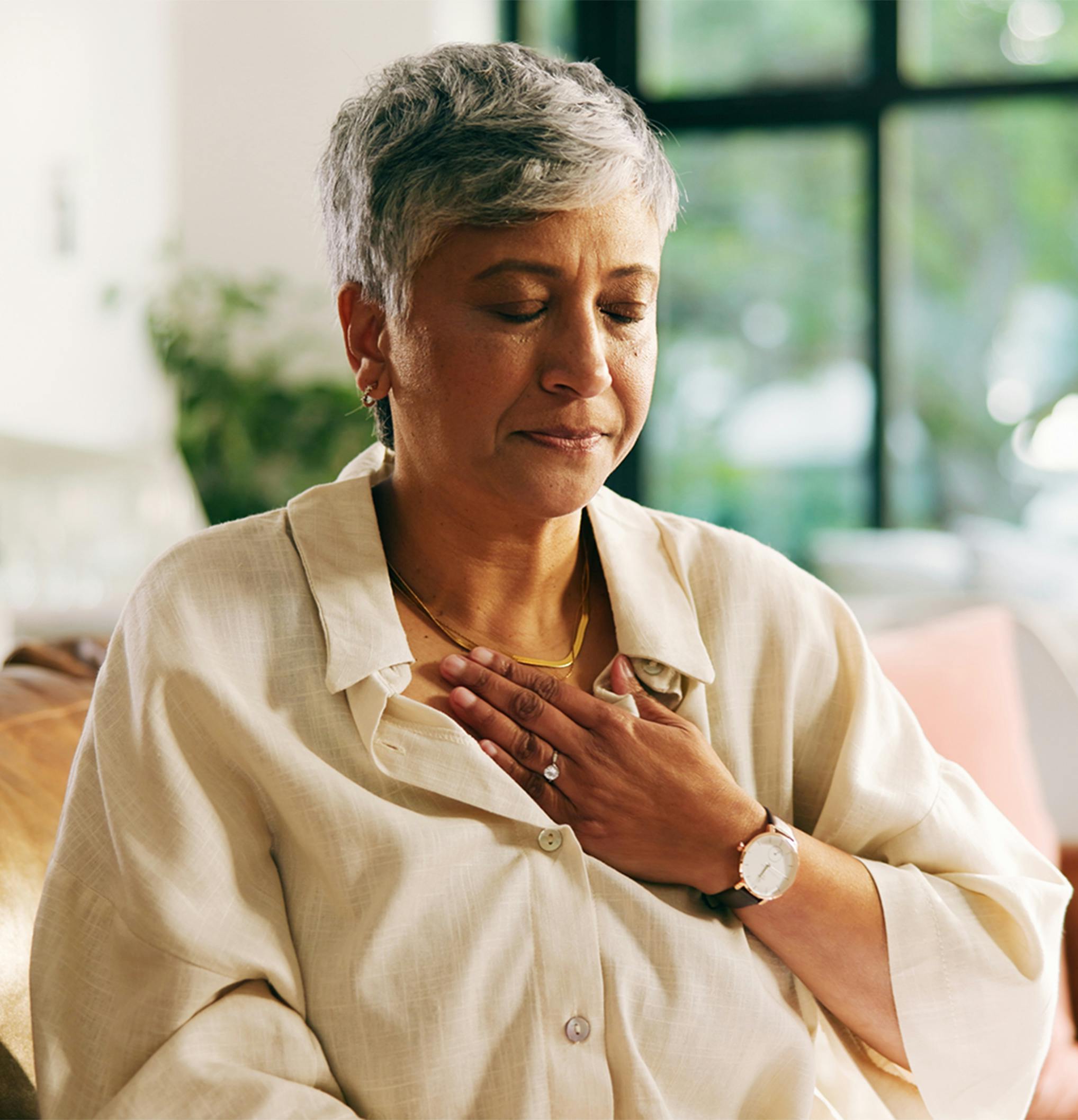 woman clutching her chest