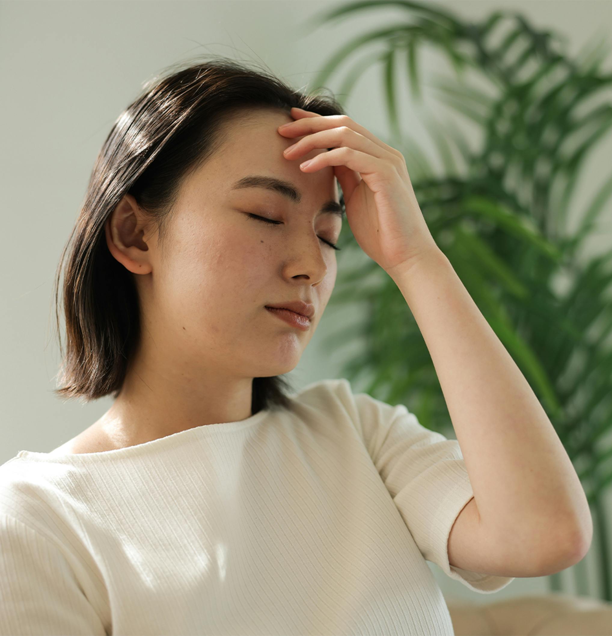 Woman touching her head