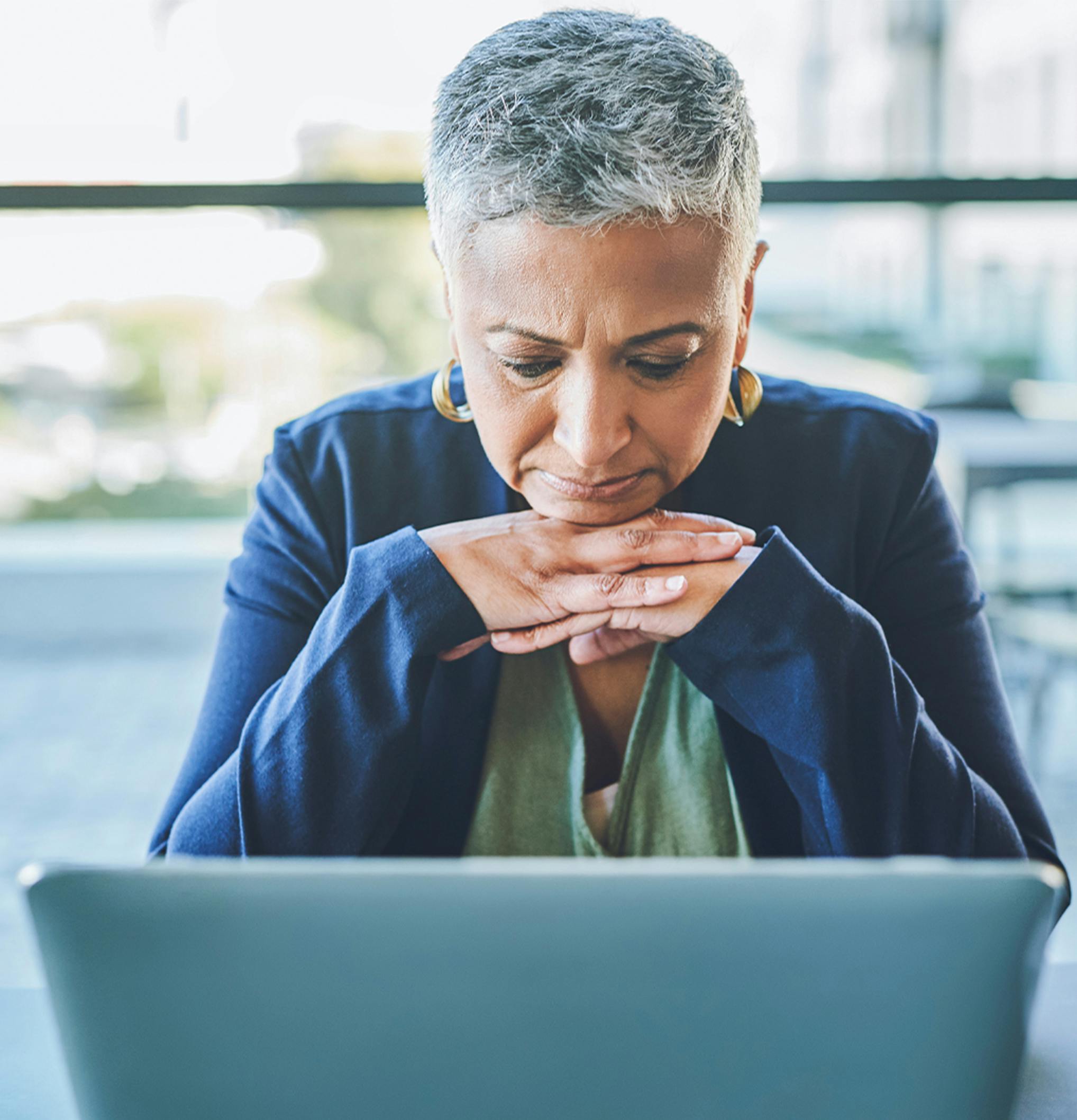 woman looking at her computer