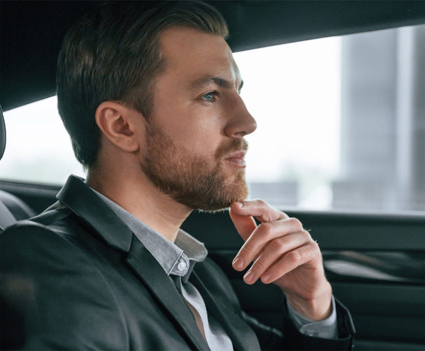 man in car