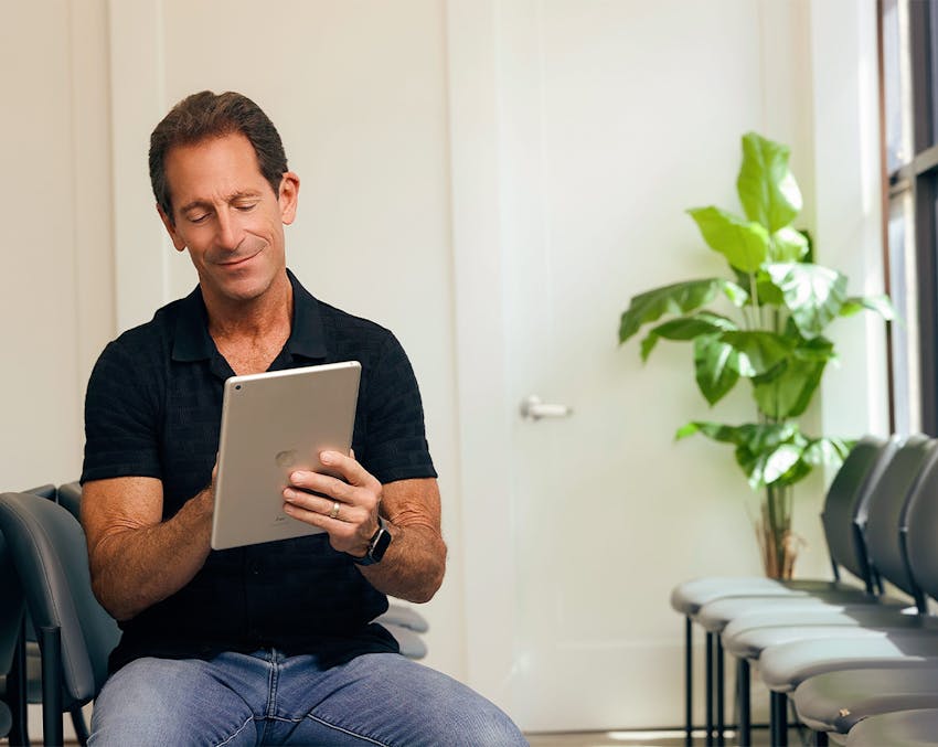 patient filling out forms on an ipad