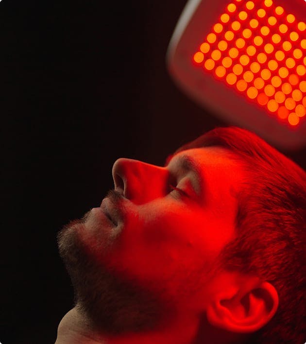 man receiving Red Light Therapy