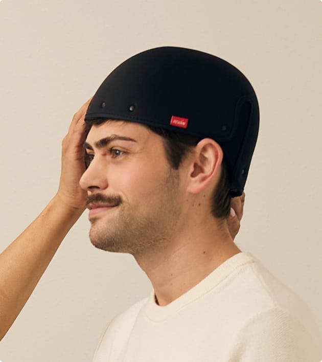man getting Laser Cap Therapy