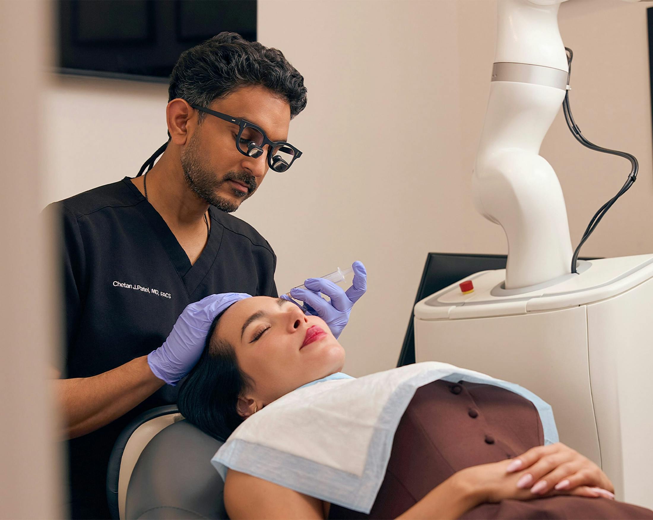 Dr. Patel performing a hair transplant procdure