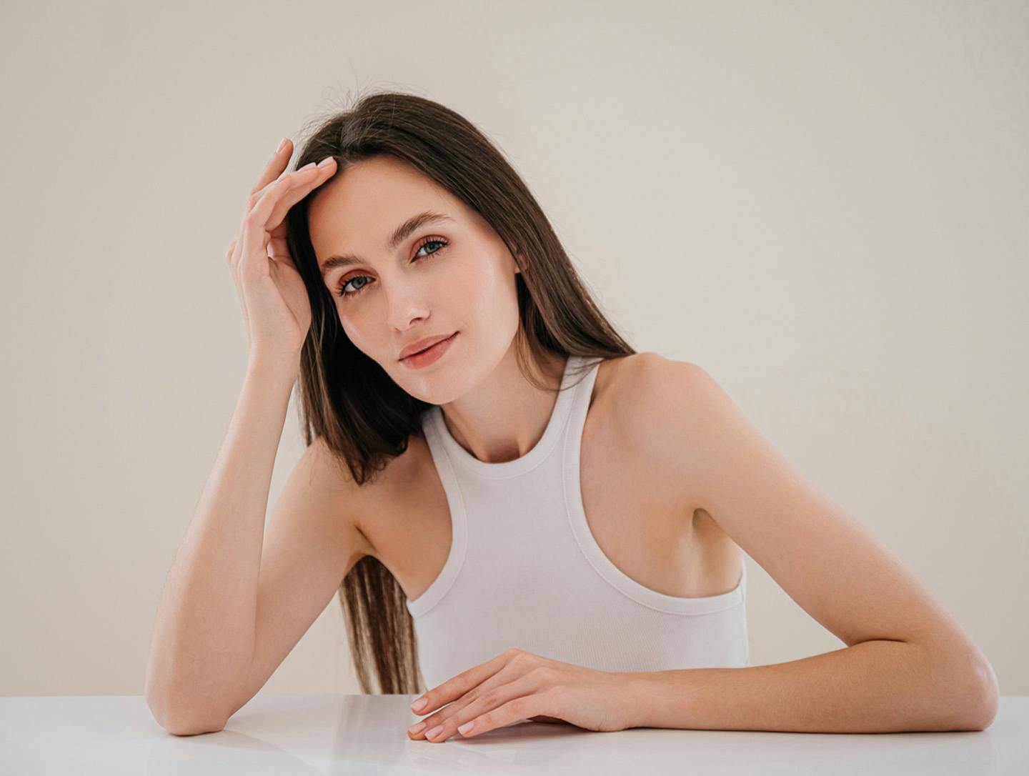 woman leaning her head on her hand