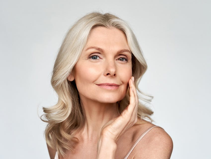 woman touching her face