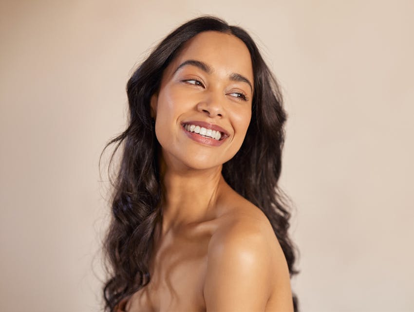 woman smiling over her shoulder