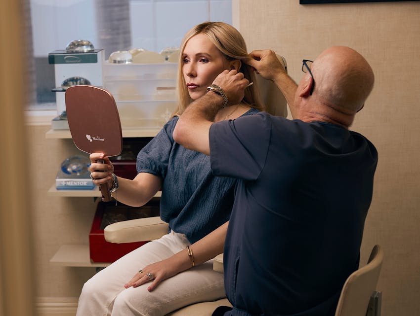 doctor examining a woman's face