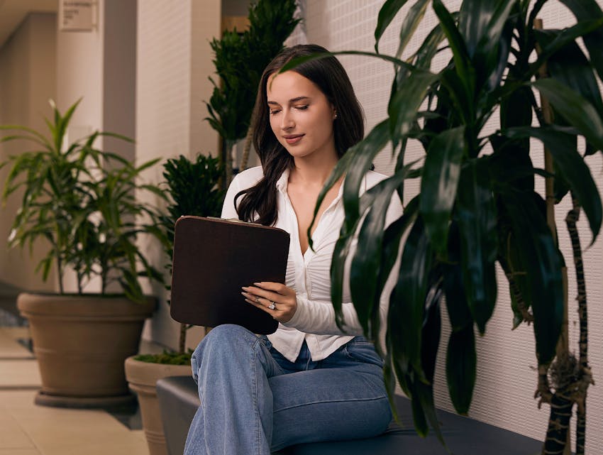 woman writing on a clipboard