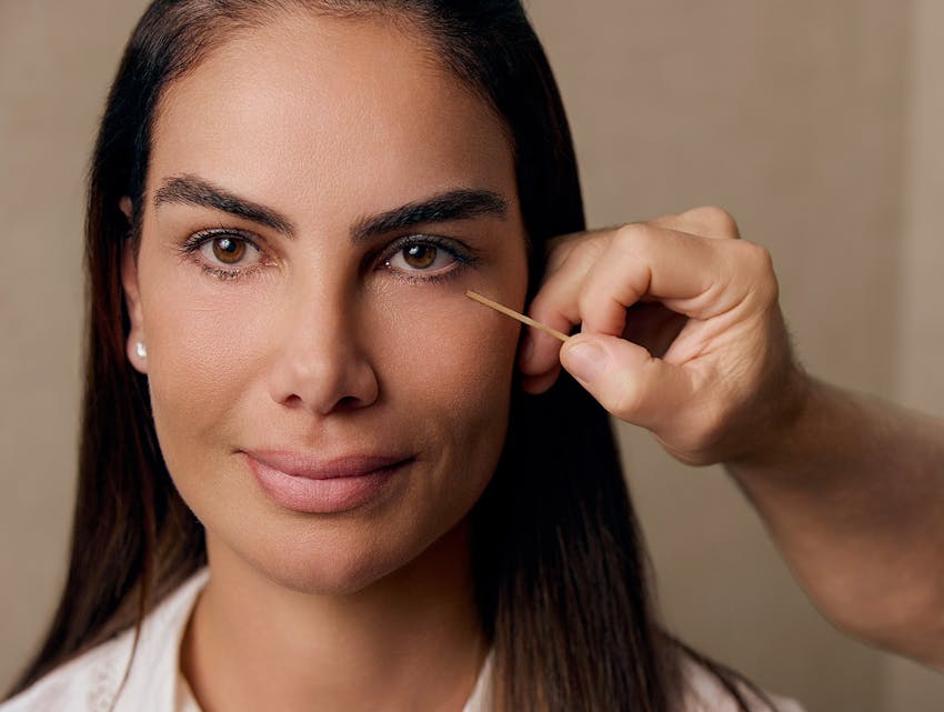 doctor pointing at a woman's face