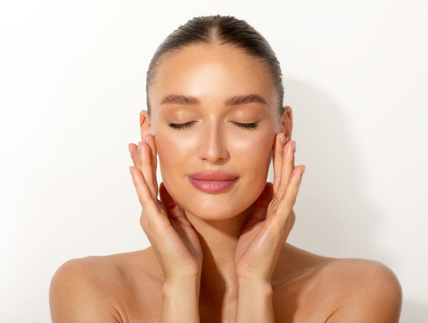 woman touching her temples
