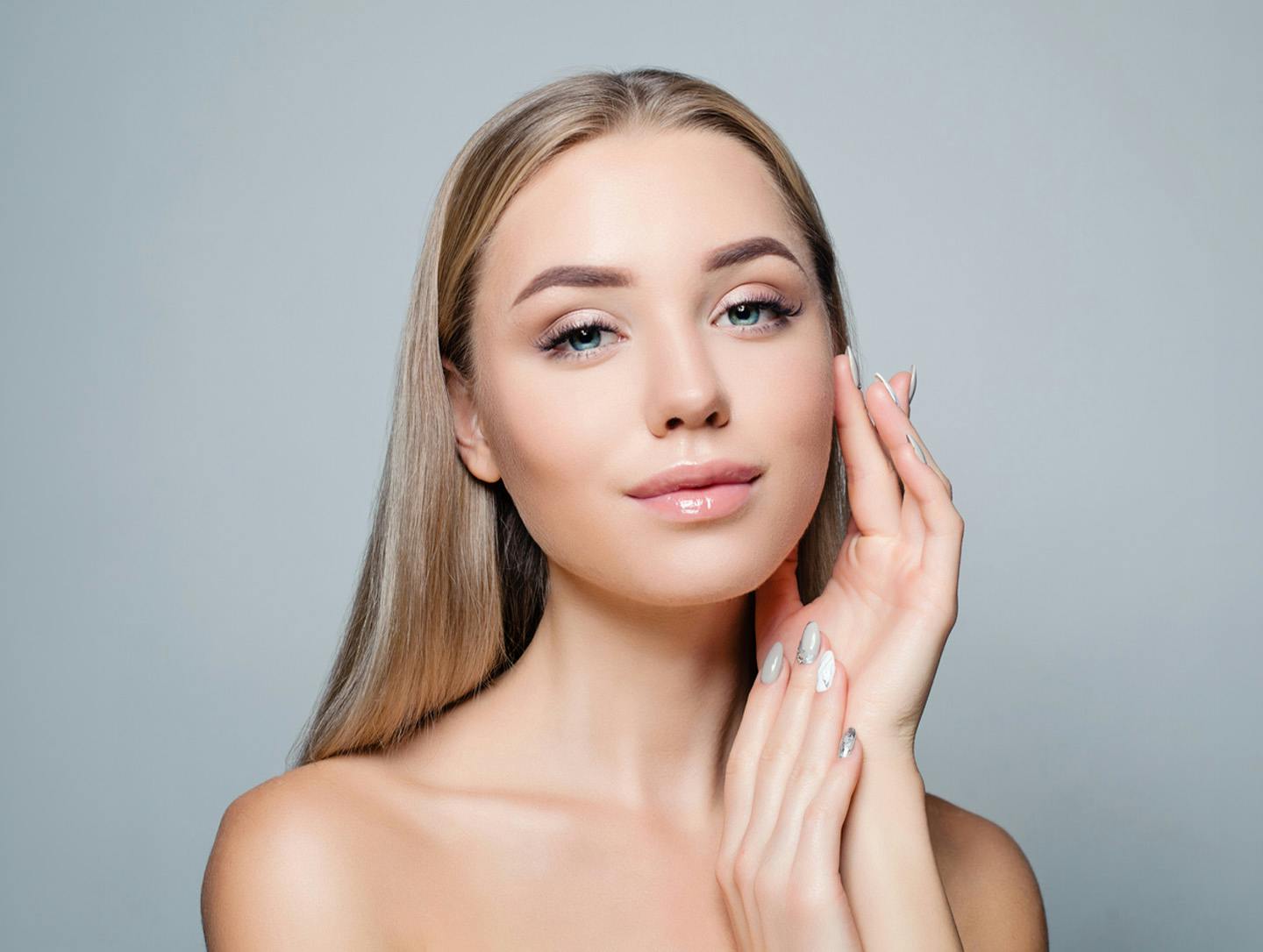 woman touching her face