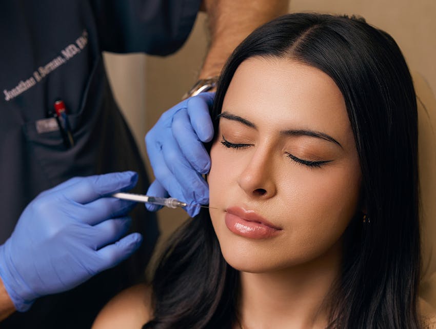 woman getting lip filler done