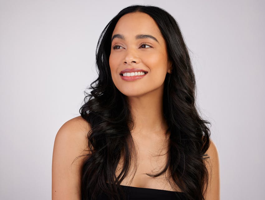 woman smiling to the side