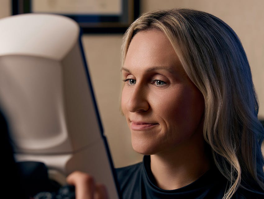 woman looking into an imaging machine