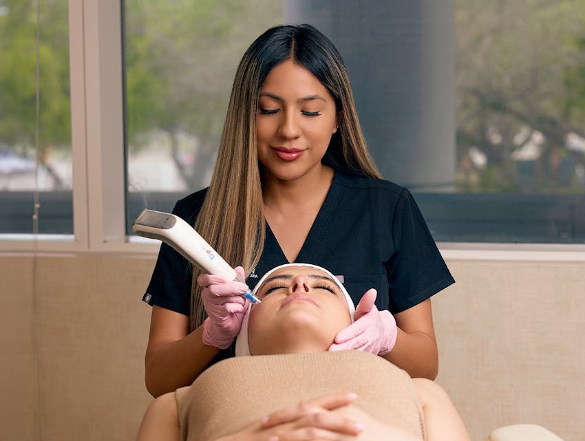 woman getting microneedling done