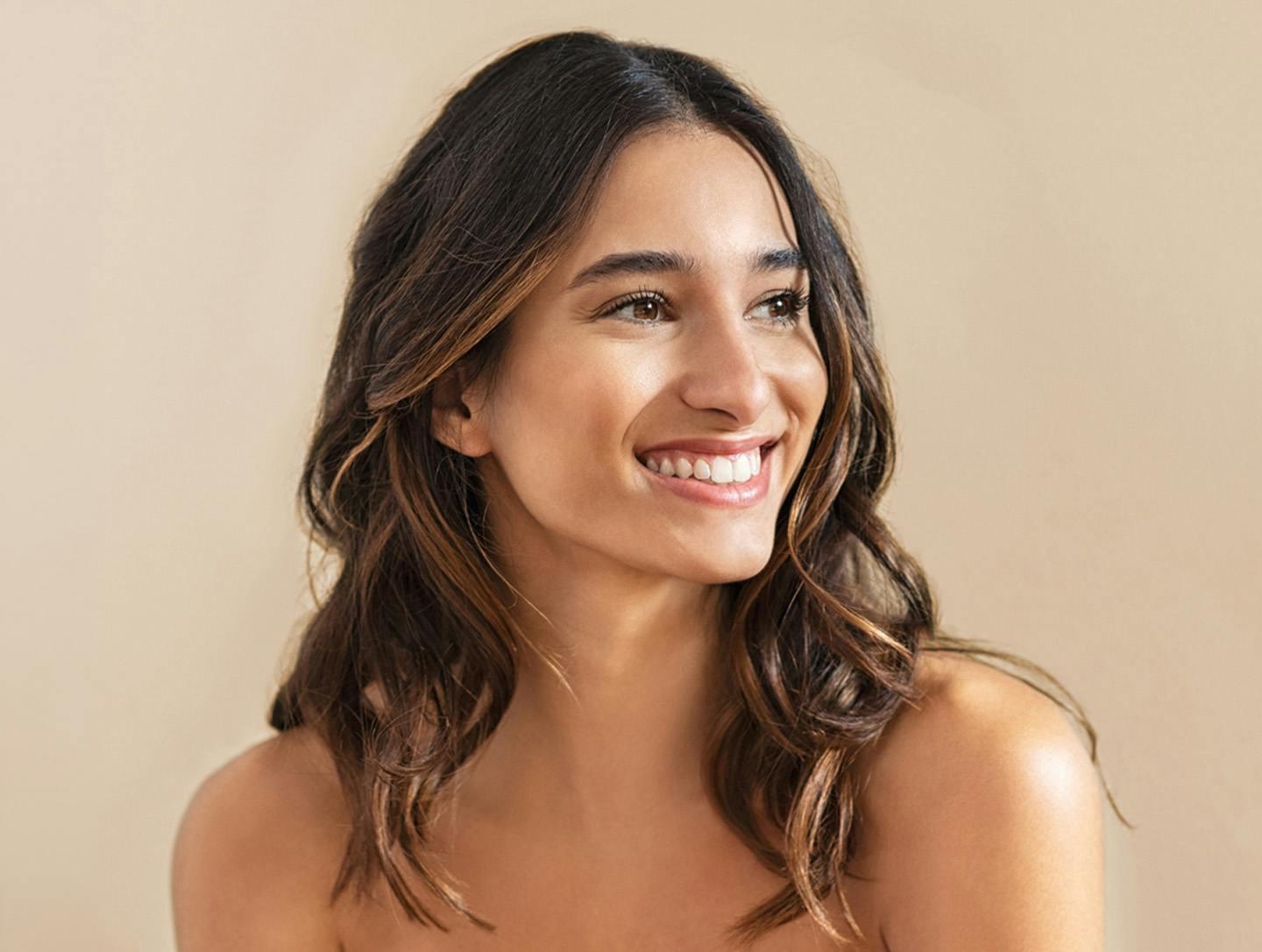woman smiling to the side