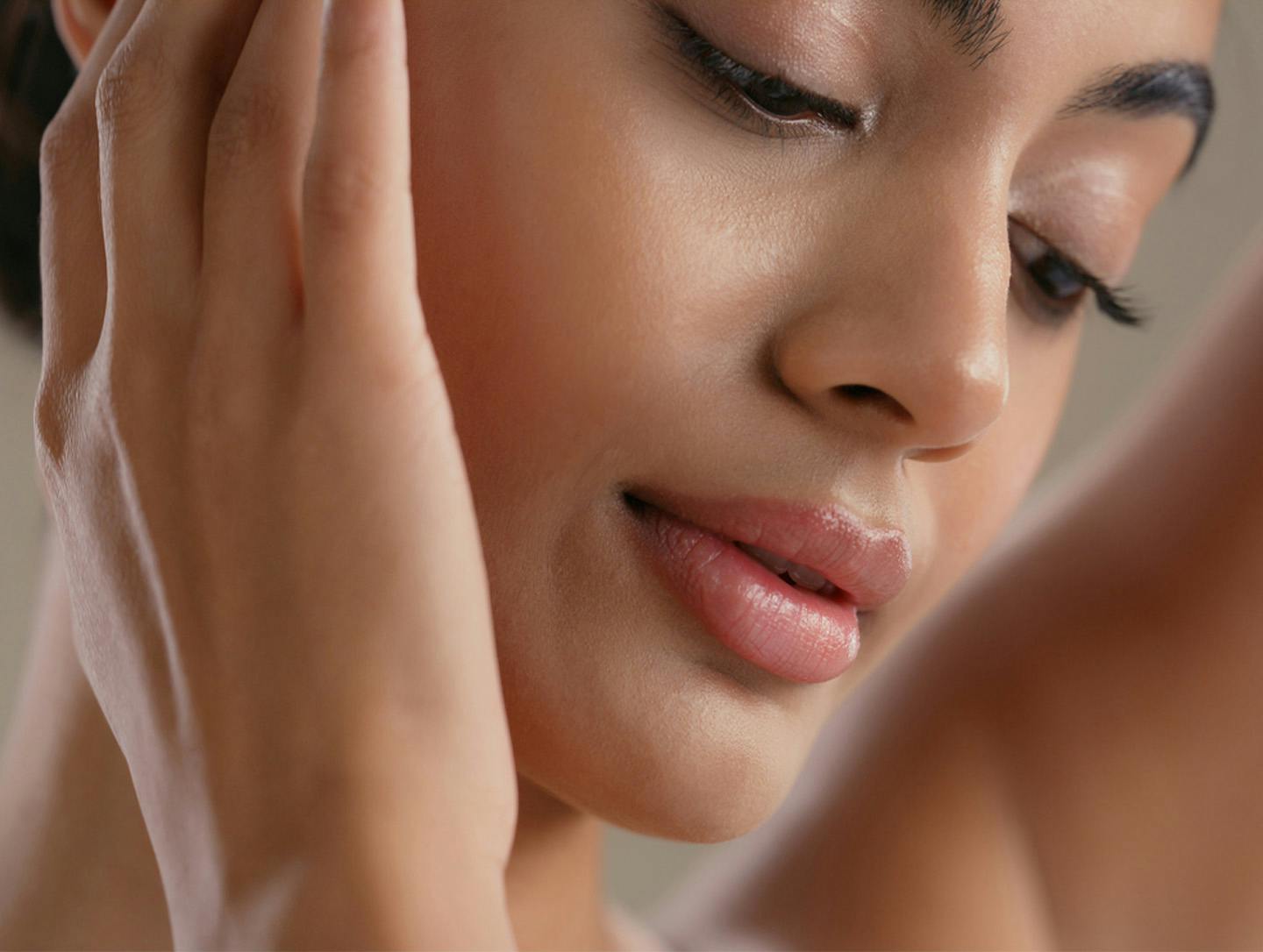 woman touching her face