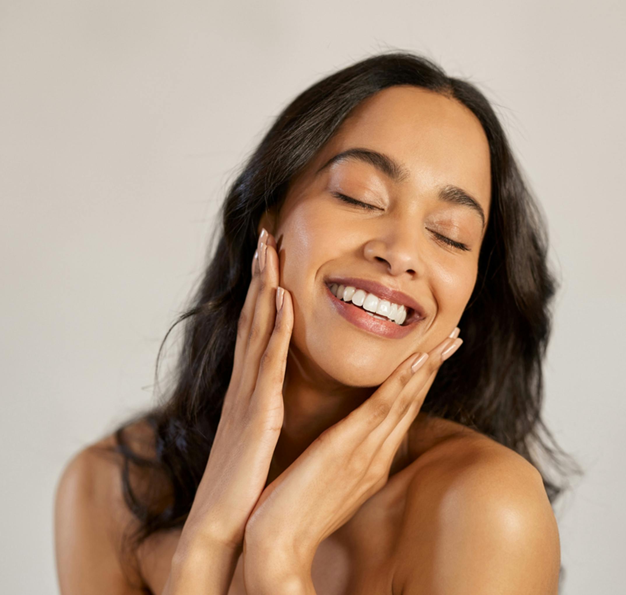 woman touching her face