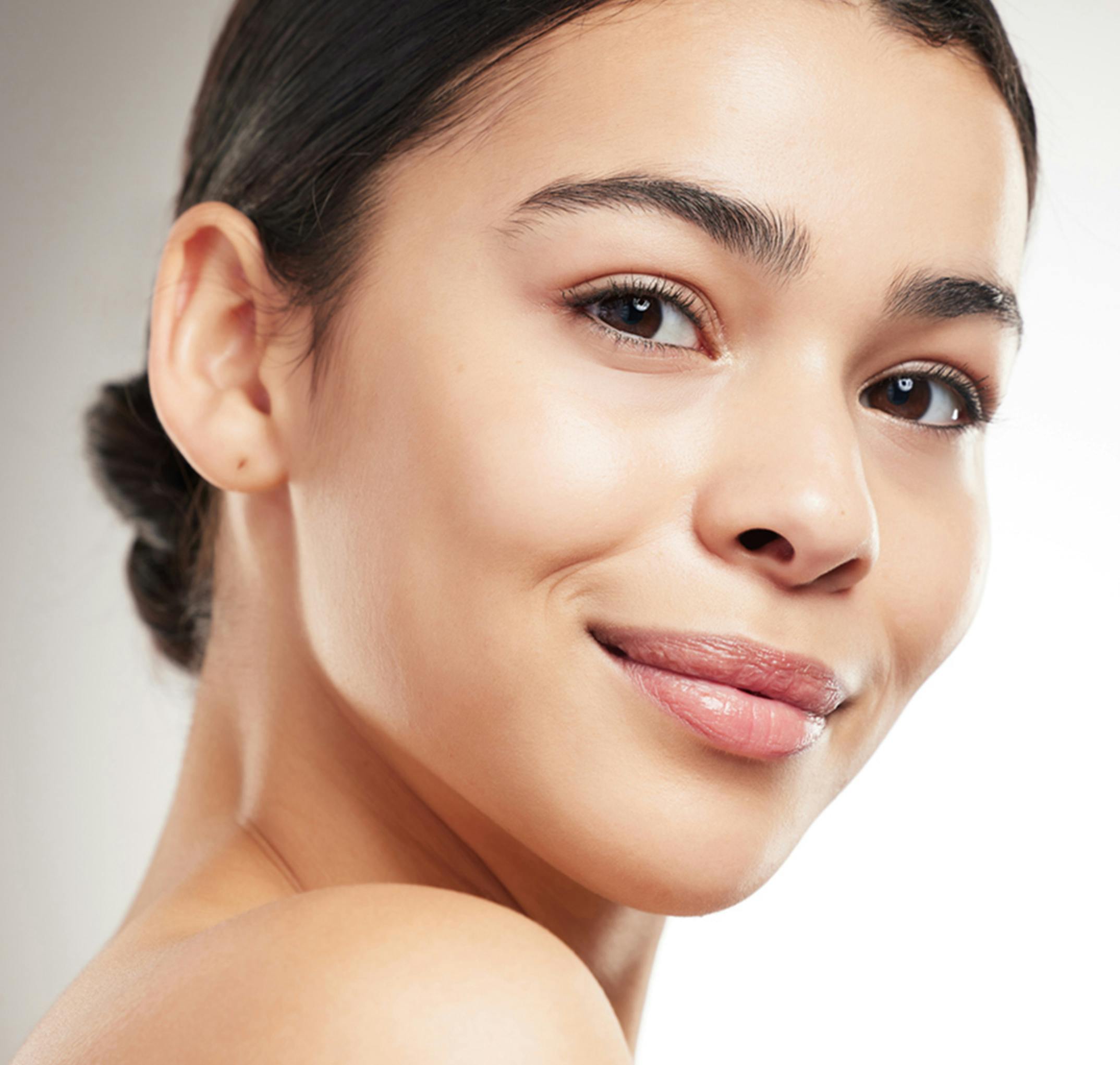 woman smiling over her shoulder