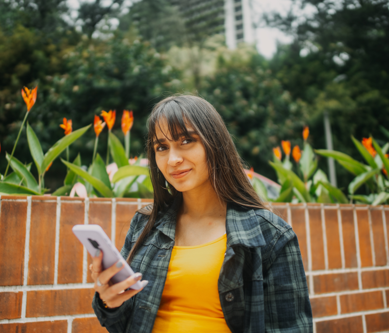 A woman holding a smartphone.