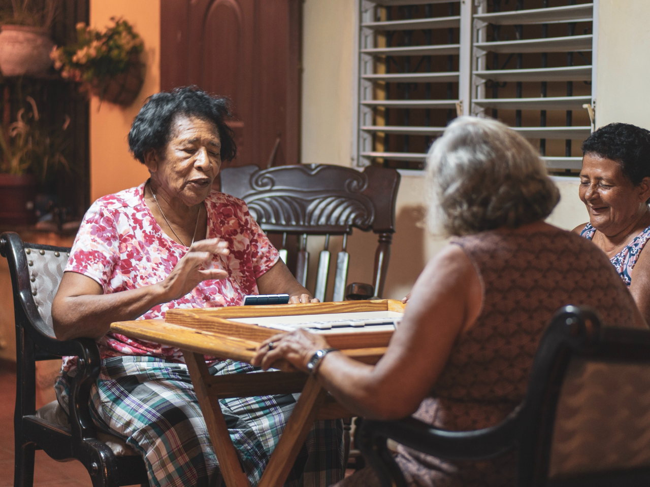 Group of women in the Dominican Republic playing a game together.
