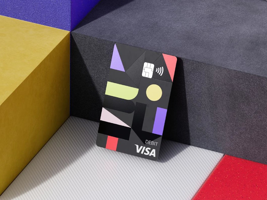Why is the debit card important for immigrants in the U.S.?