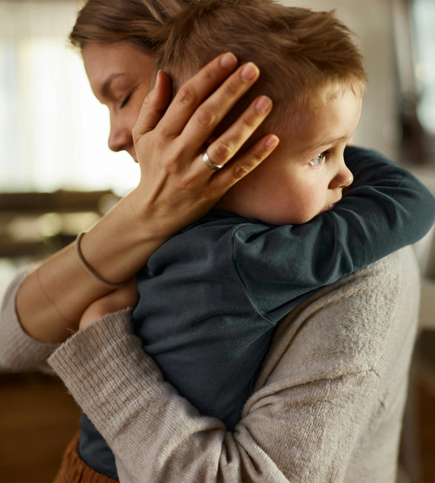 Woman hugging a toddler